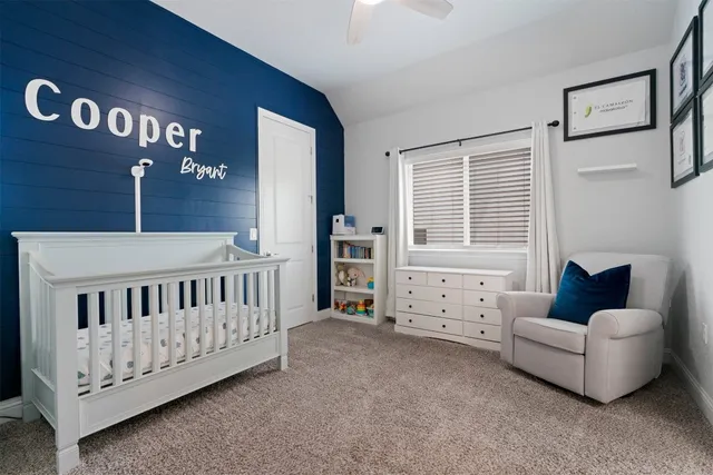 a bedroom with furniture and a window