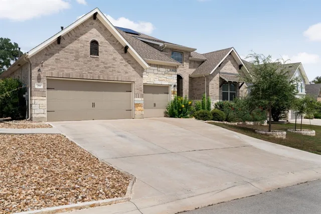 a view of a white house with a outdoor space