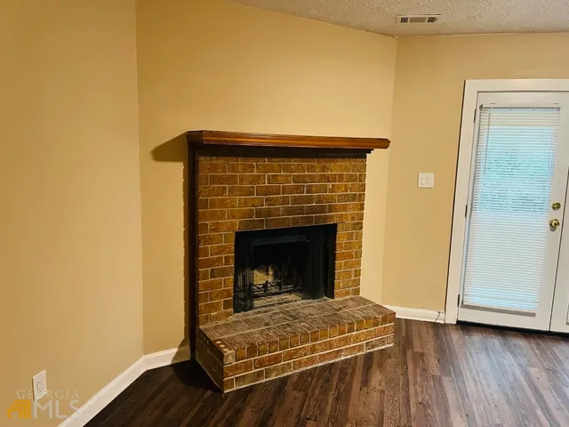 a living room with a fireplace