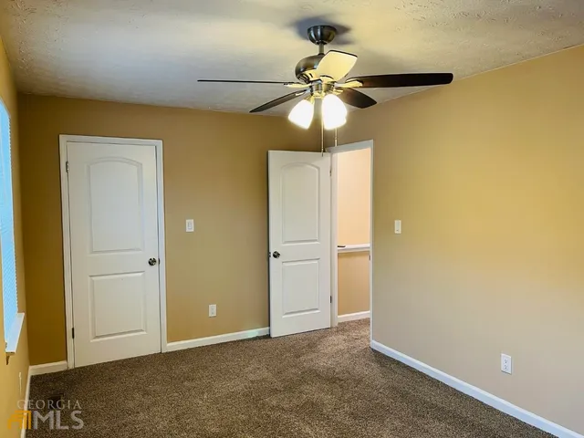 a front view of a house with garage