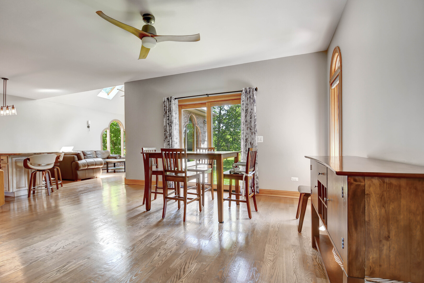 1383 Gordon Lane Lemont, IL 60439 - Photo 13 of 54 a view of a dining room with furniture window and wooden floor