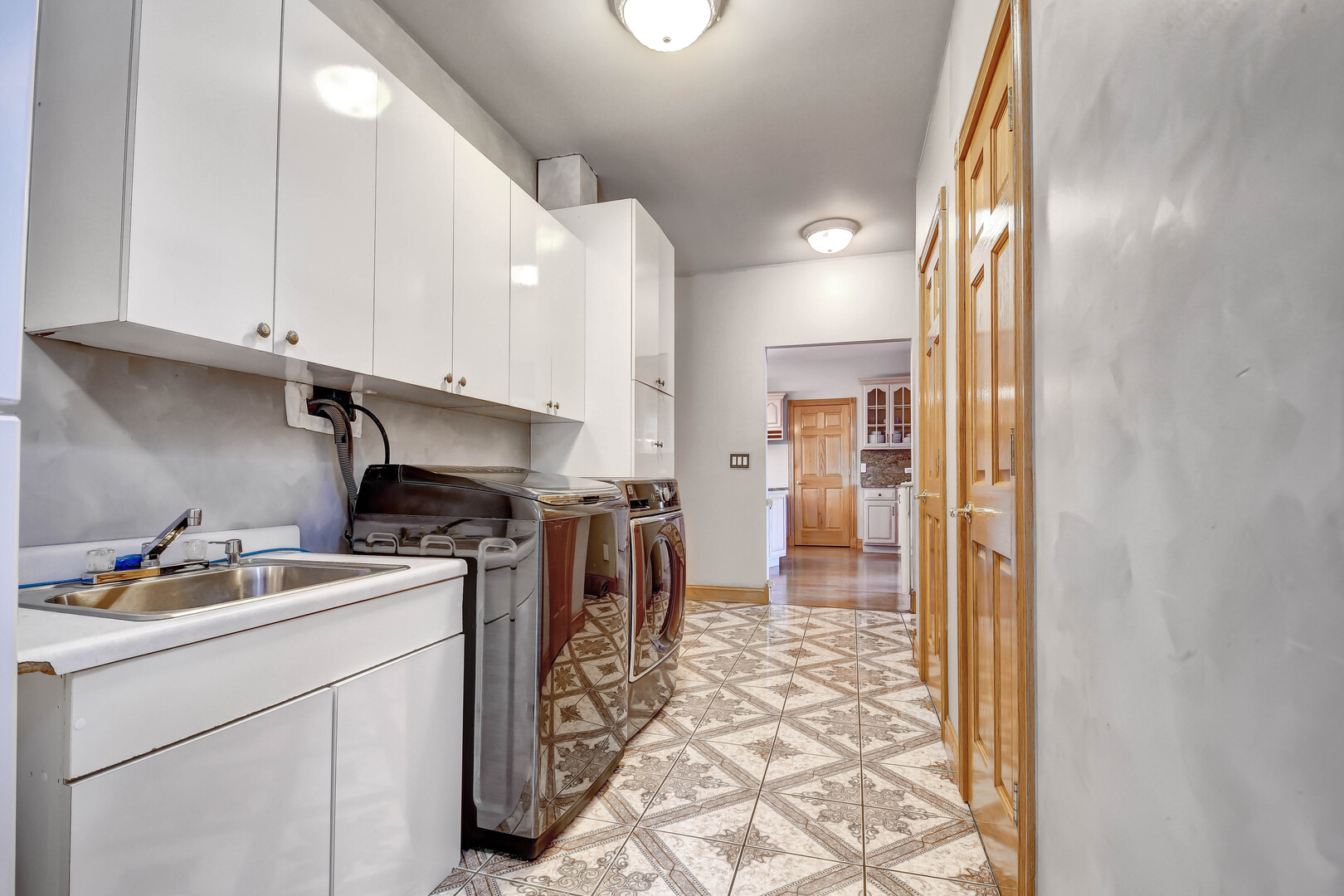 1383 Gordon Lane Lemont, IL 60439 - Photo 19 of 54 a kitchen with a sink cabinets and appliances