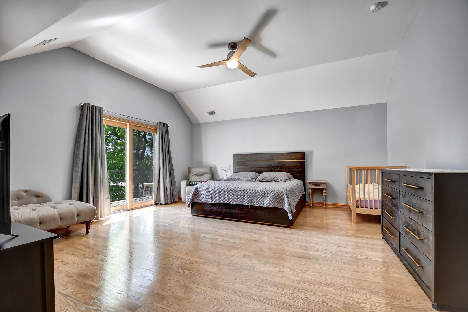 1383 Gordon Lane Lemont, IL 60439 - Photo 23 of 54 a spacious bedroom with a bed and wooden floor