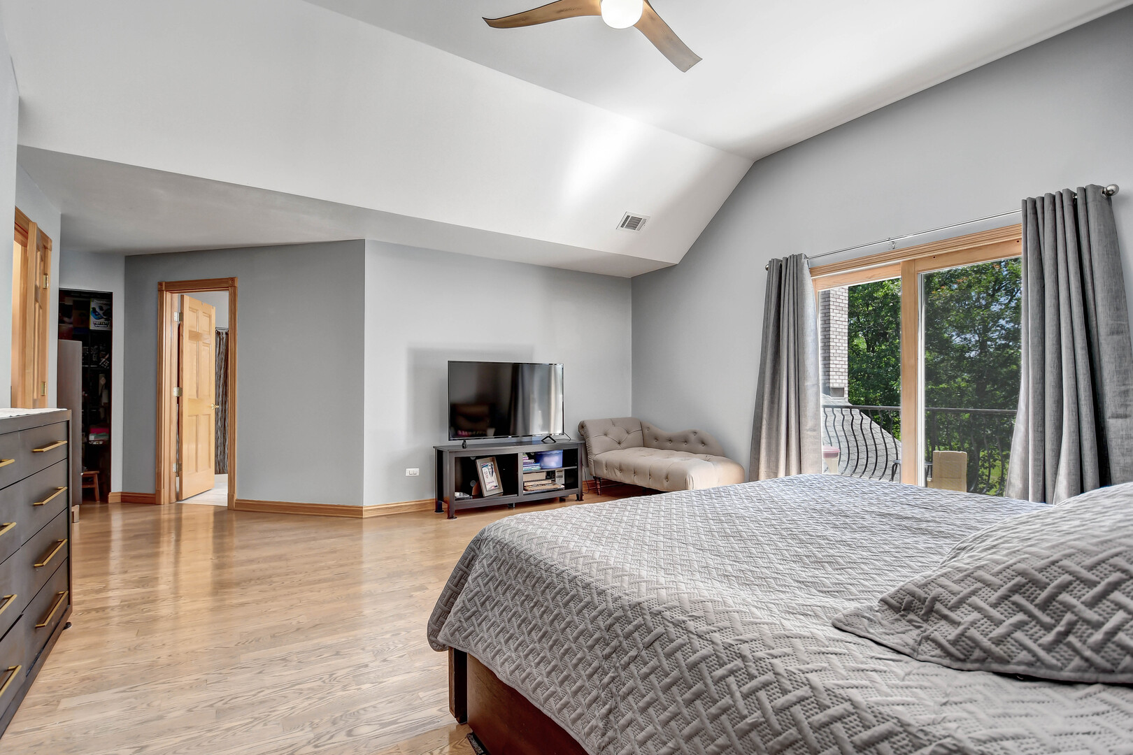 1383 Gordon Lane Lemont, IL 60439 - Photo 24 of 54 a bedroom with a bed and a flat screen tv