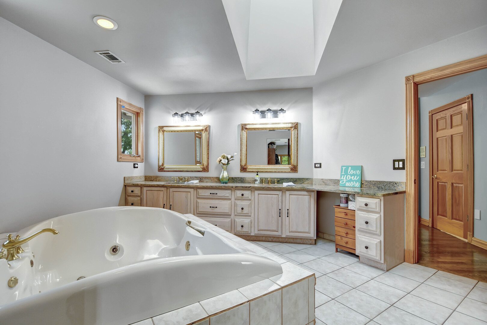 1383 Gordon Lane Lemont, IL 60439 - Photo 25 of 54 a bathroom with a tub sink and mirror