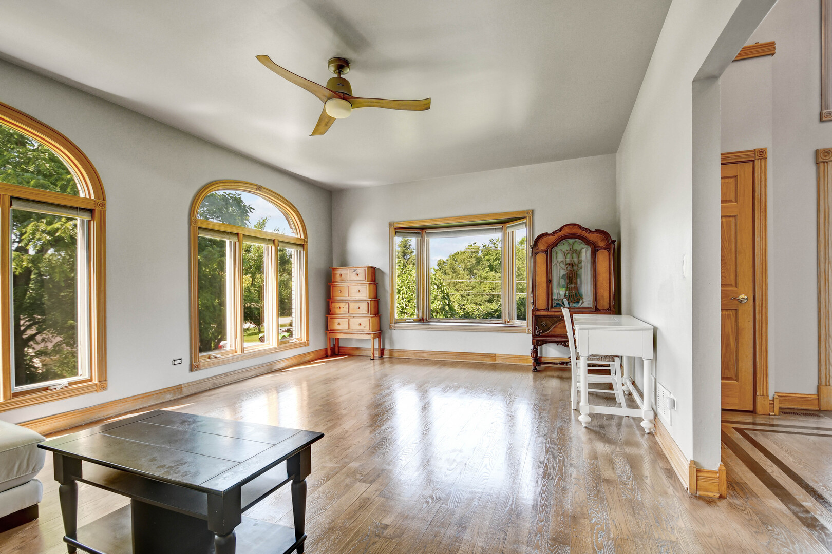 1383 Gordon Lane Lemont, IL 60439 - Photo 3 of 54 a view of a livingroom with wooden floor and a ceiling fan