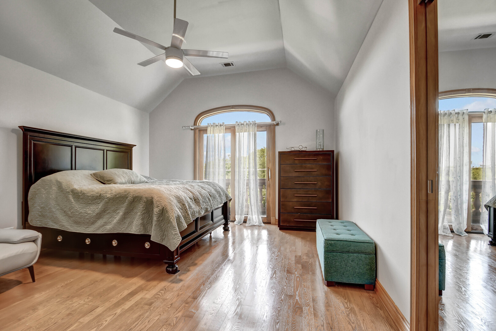 1383 Gordon Lane Lemont, IL 60439 - Photo 31 of 54 a spacious bedroom with a bed a dresser and wooden floor