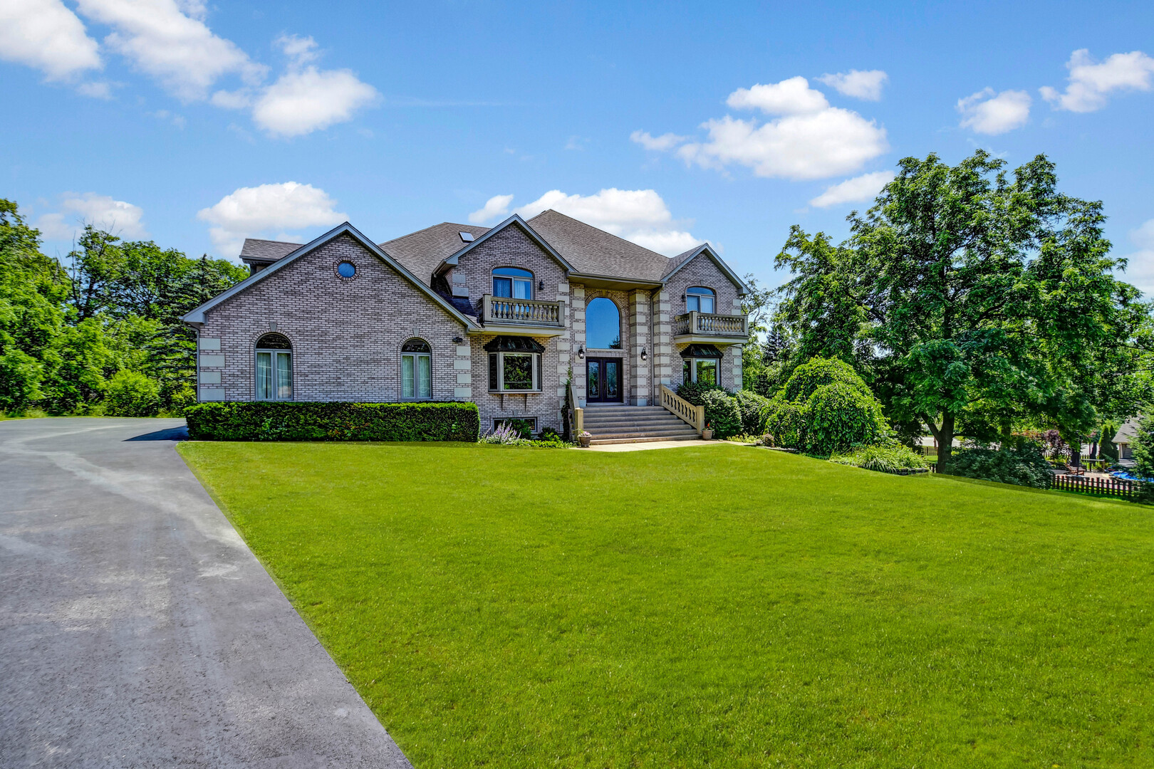 1383 Gordon Lane Lemont, IL 60439 - Photo 35 of 54 a front view of a house with a garden and plants