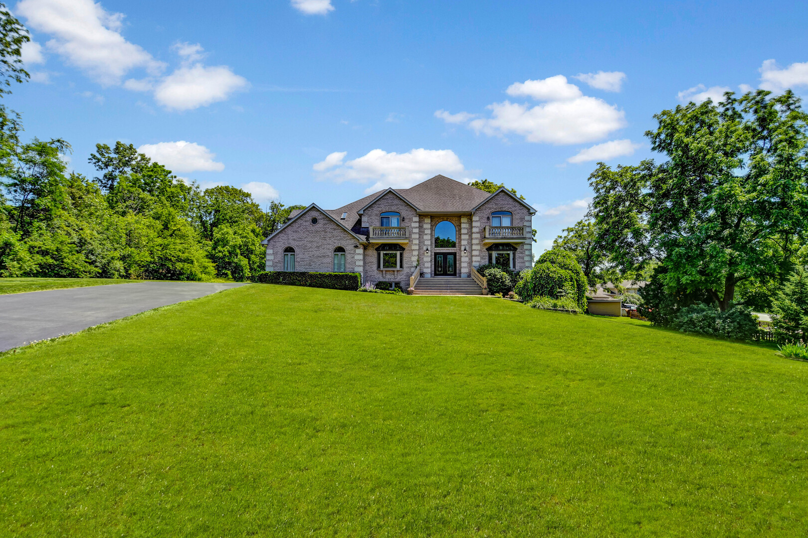 1383 Gordon Lane Lemont, IL 60439 - Photo 36 of 54 a view of a house with a big yard and large trees