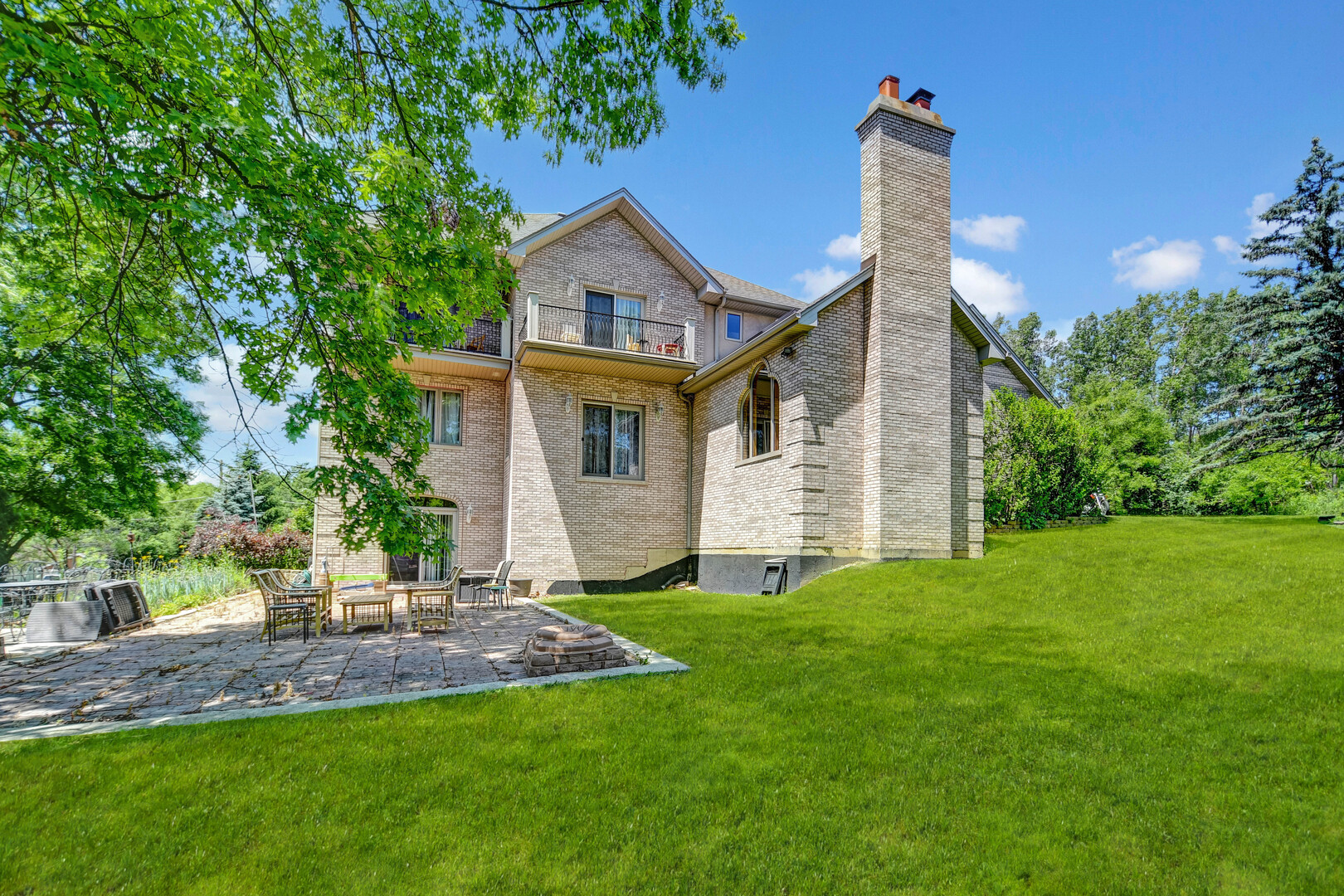 1383 Gordon Lane Lemont, IL 60439 - Photo 44 of 54 a front view of a house with a yard and trees