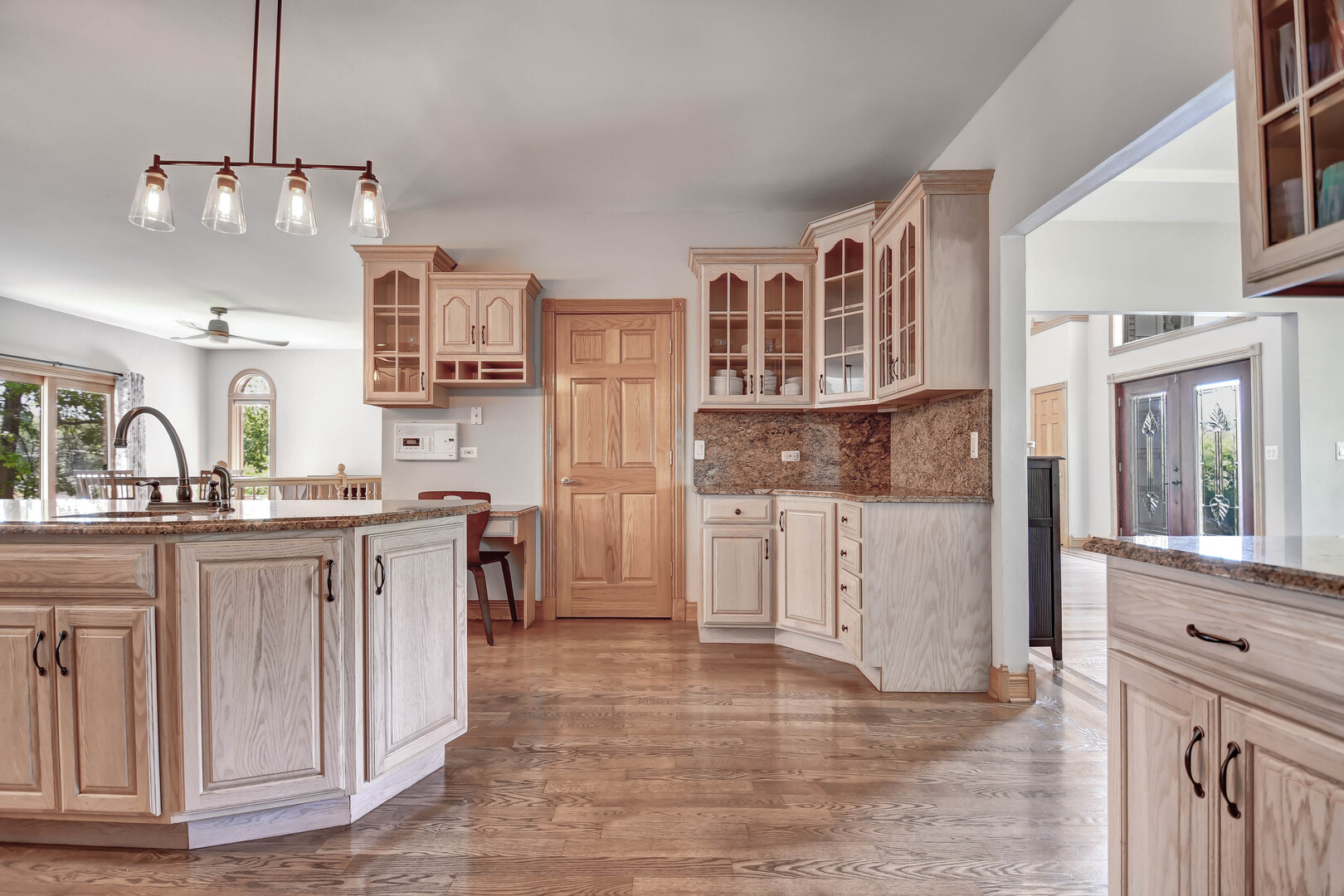 1383 Gordon Lane Lemont, IL 60439 - Photo 8 of 54 a kitchen with cabinets and wooden floor