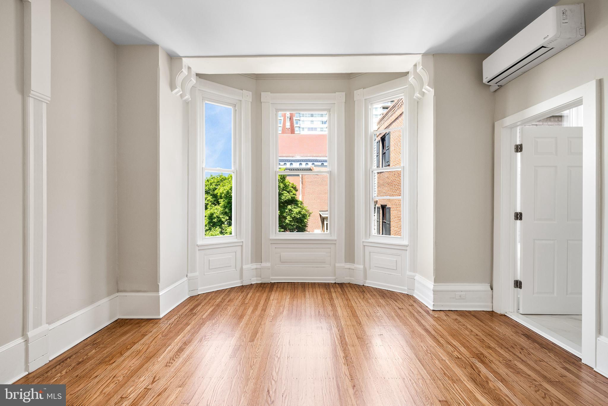 2311 Green Street, Unit 2F Philadelphia, PA 19130 - Photo 11 of 13 a view of empty room with wooden floor and fan