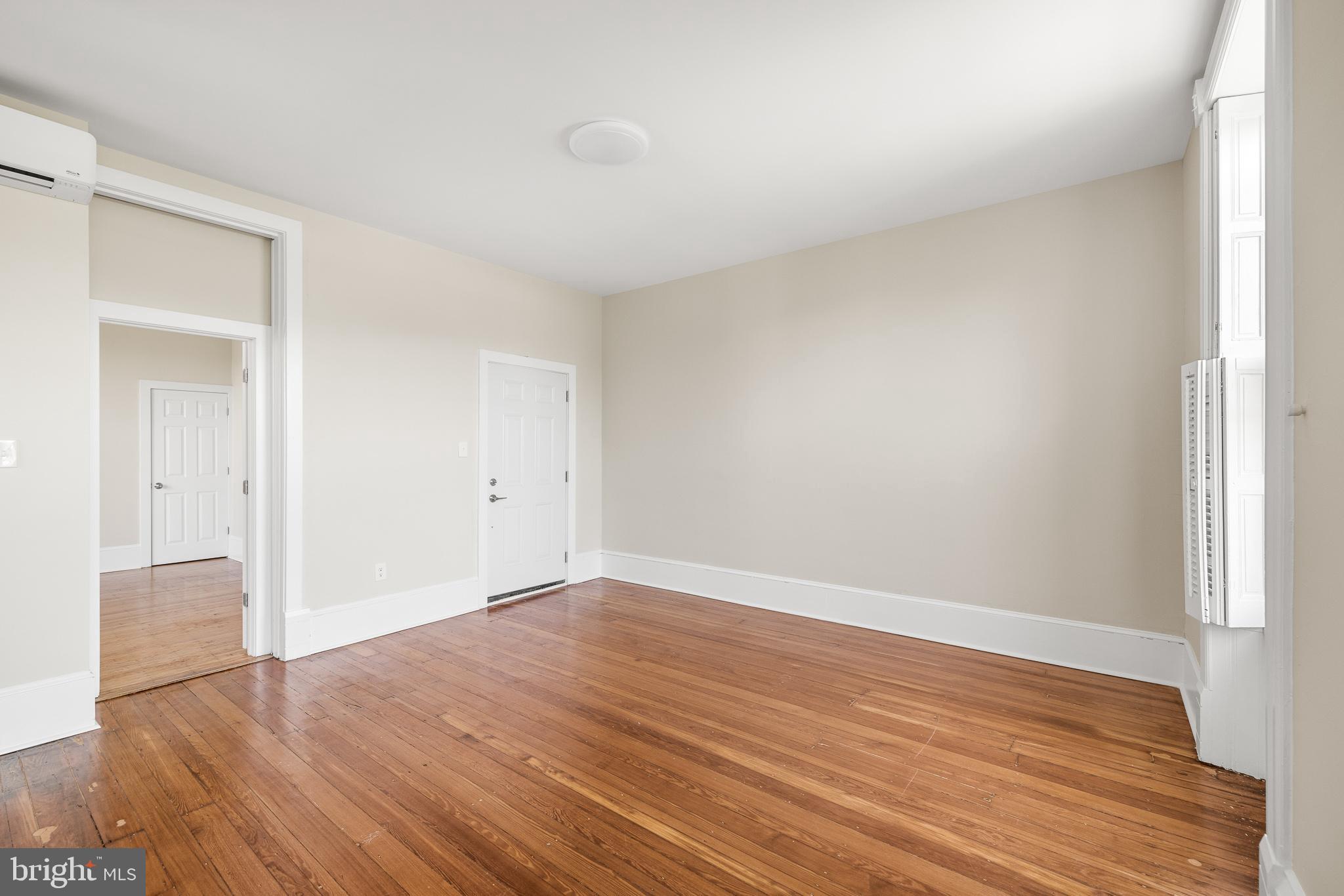 2311 Green Street, Unit 2F Philadelphia, PA 19130 - Photo 5 of 13 a view of an empty room and wooden floor