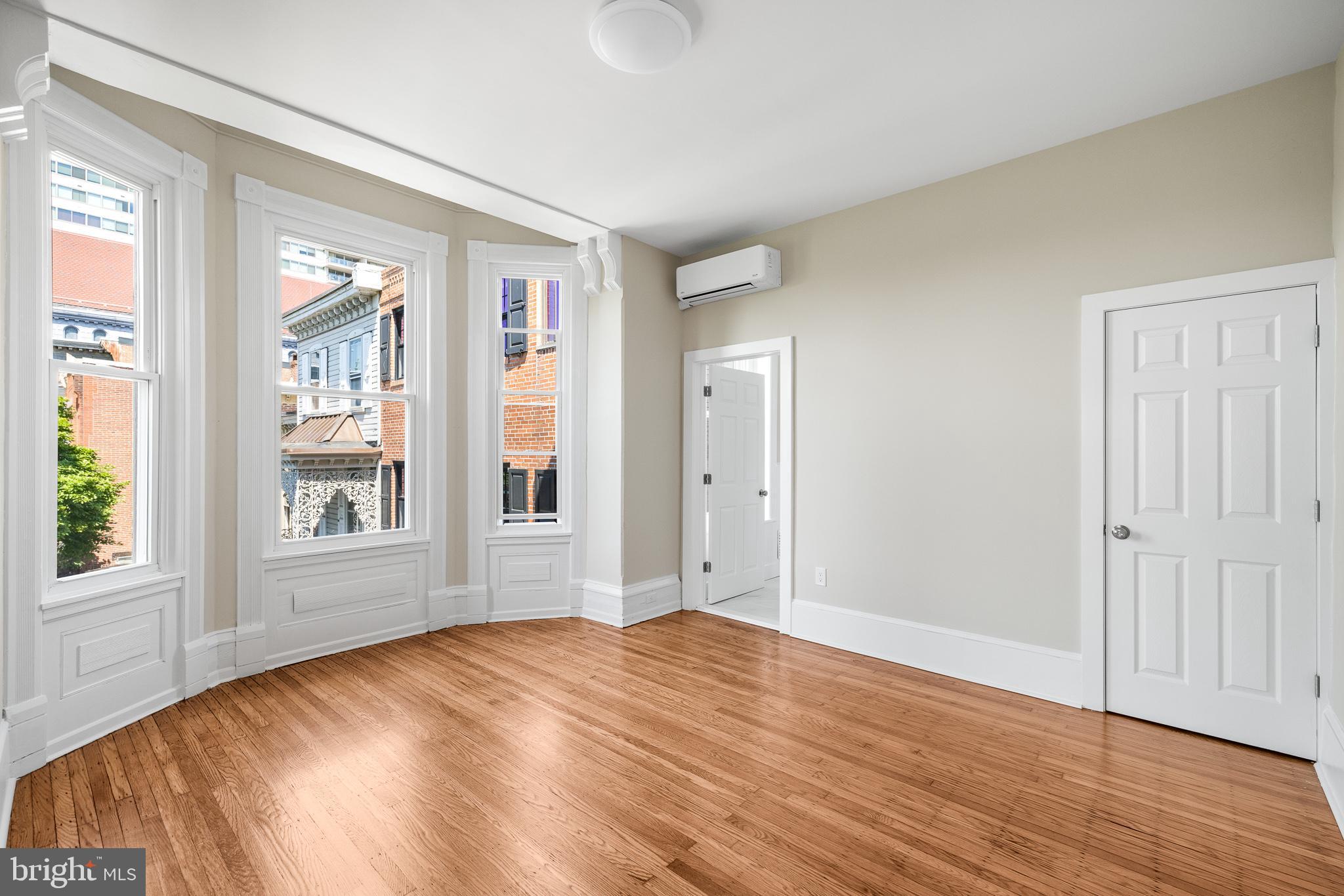 2311 Green Street, Unit 2F Philadelphia, PA 19130 - Photo 6 of 13 a view of empty room with wooden floor and fan