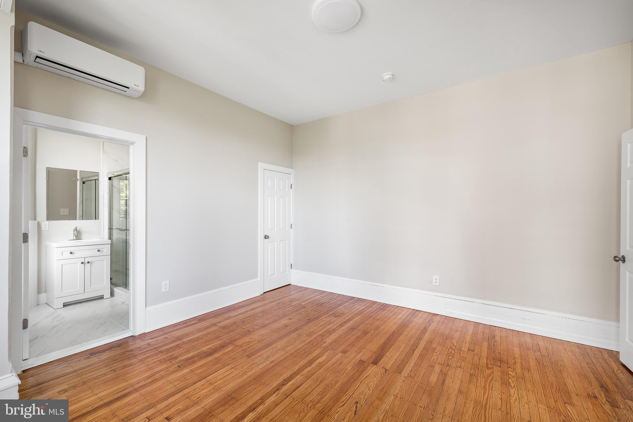 2311 Green Street, Unit 2F Philadelphia, PA 19130 - Photo 8 of 13 a view of a room with wooden floor and white walls