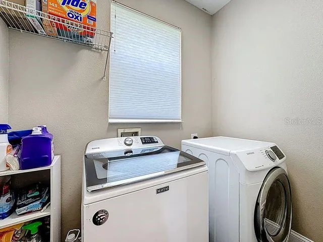an aerial view of residential building and lake