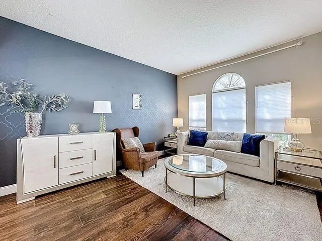 a living room with furniture and window