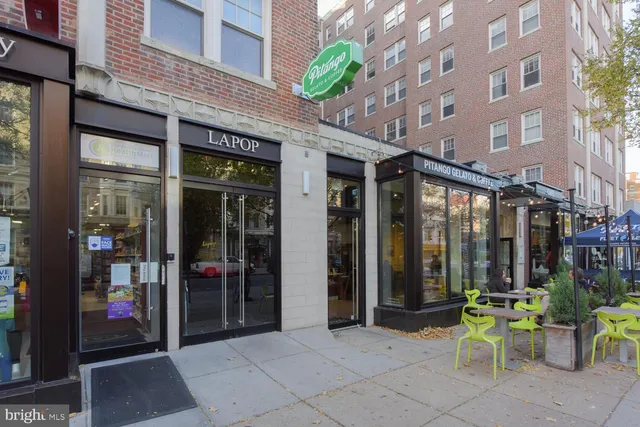 a view of a building with sitting area