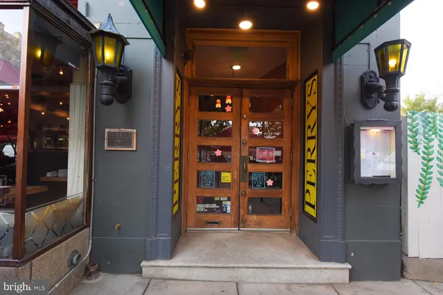 a view of an chair and table in the patio and a glass door