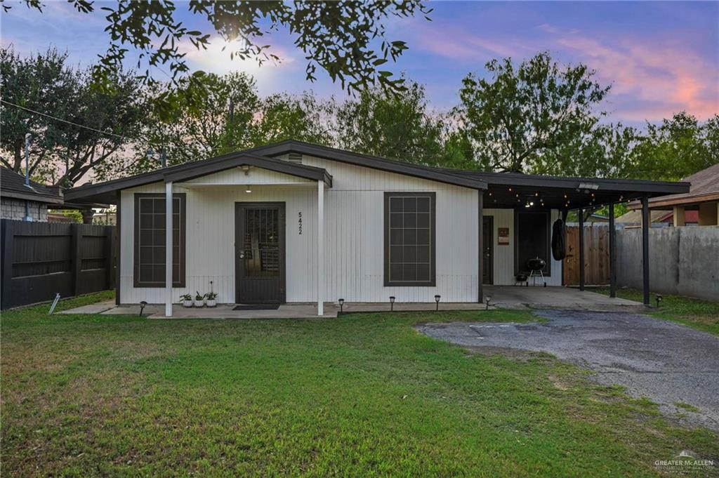 5422 South 28th Street McAllen, TX 78503 - Photo 1 of 21 View of front facade featuring asphalt driveway, an attached carport, and a patio