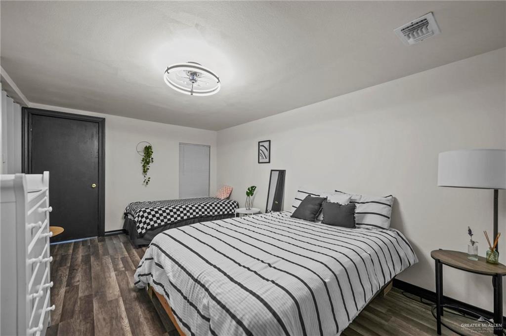 5422 South 28th Street McAllen, TX 78503 - Photo 17 of 21 Bedroom featuring dark wood-type flooring