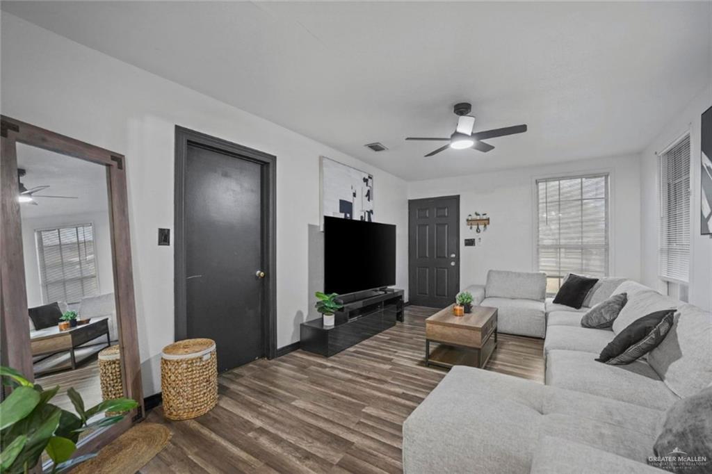 5422 South 28th Street McAllen, TX 78503 - Photo 7 of 21 Living room featuring ceiling fan and dark wood-style floors
