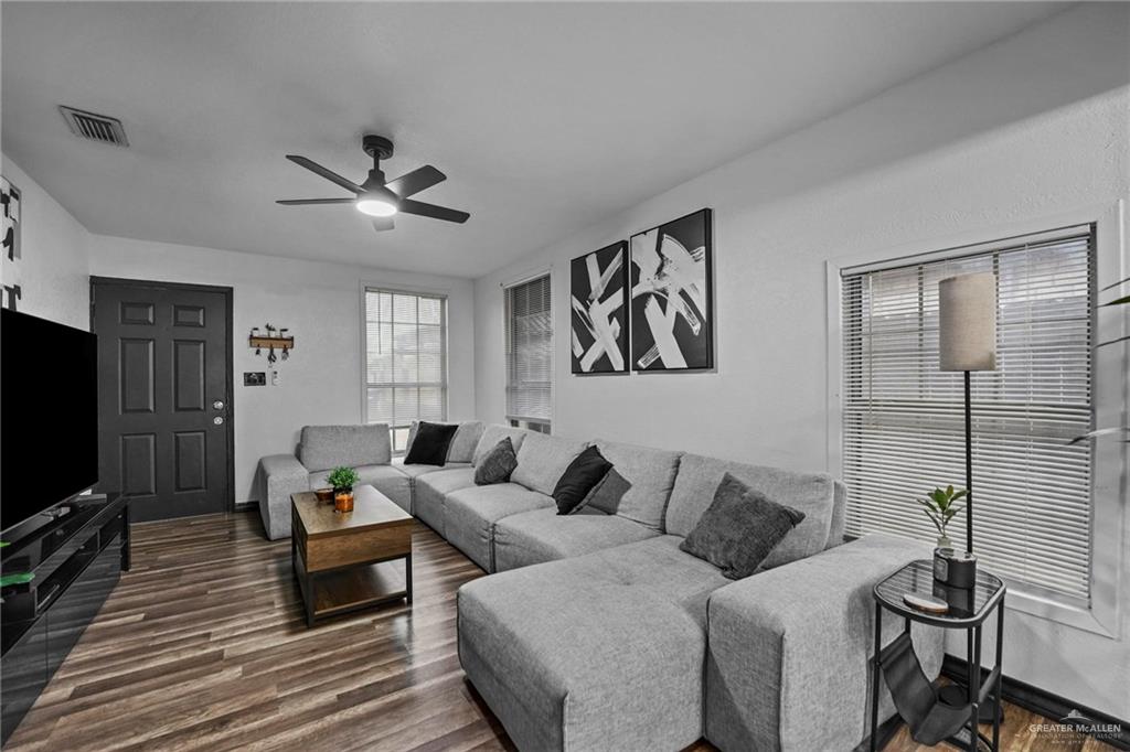 5422 South 28th Street McAllen, TX 78503 - Photo 8 of 21 Living area with dark wood-style floors and ceiling fan