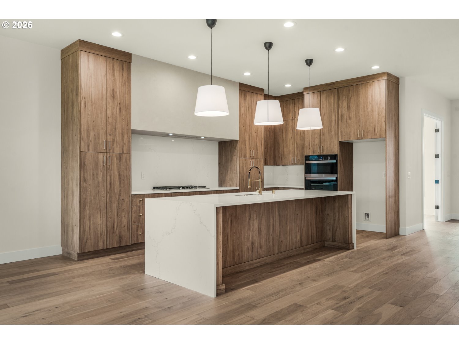 2040 South River Road Kelso, WA 98626 - Photo 12 of 43 a kitchen with kitchen island a refrigerator and a sink