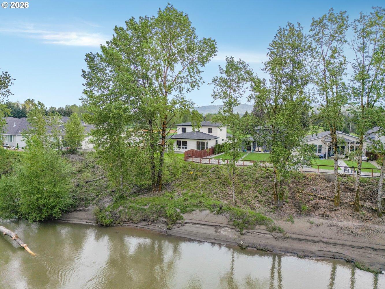 2040 South River Road Kelso, WA 98626 - Photo 2 of 43 a view of a lake with a building in the background
