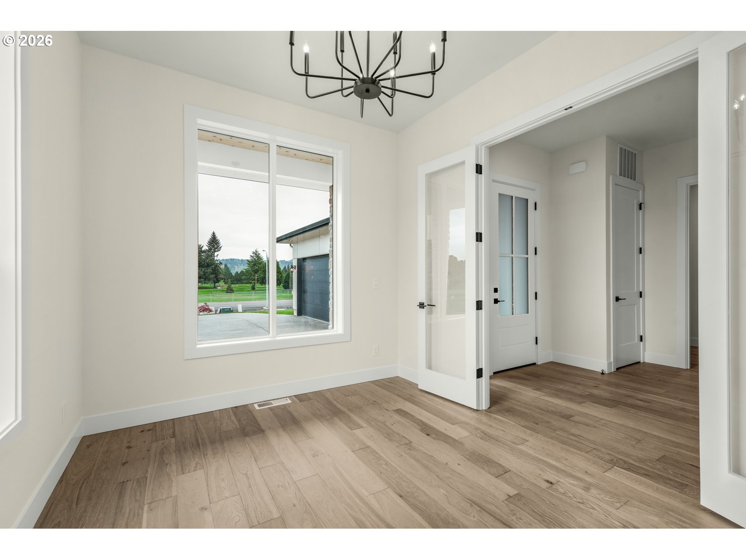 2040 South River Road Kelso, WA 98626 - Photo 23 of 43 a view of an empty room with a window and wooden floor