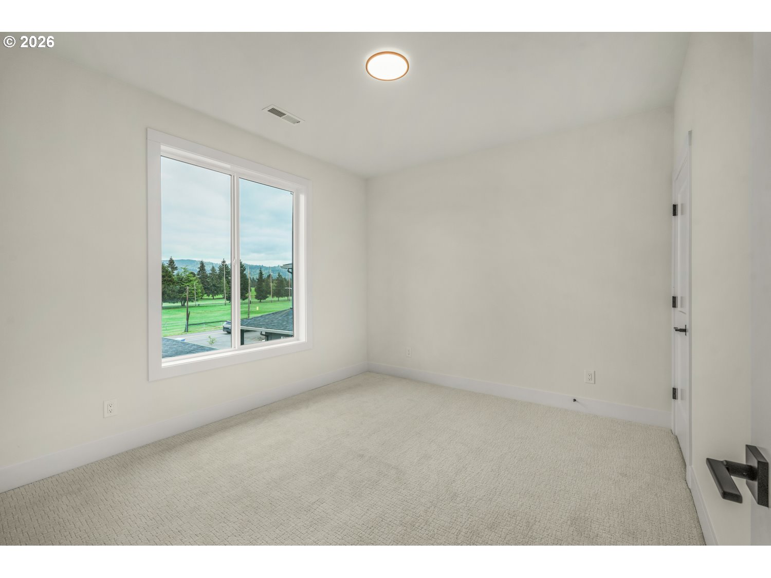 2040 South River Road Kelso, WA 98626 - Photo 29 of 43 a view of an empty room with a window
