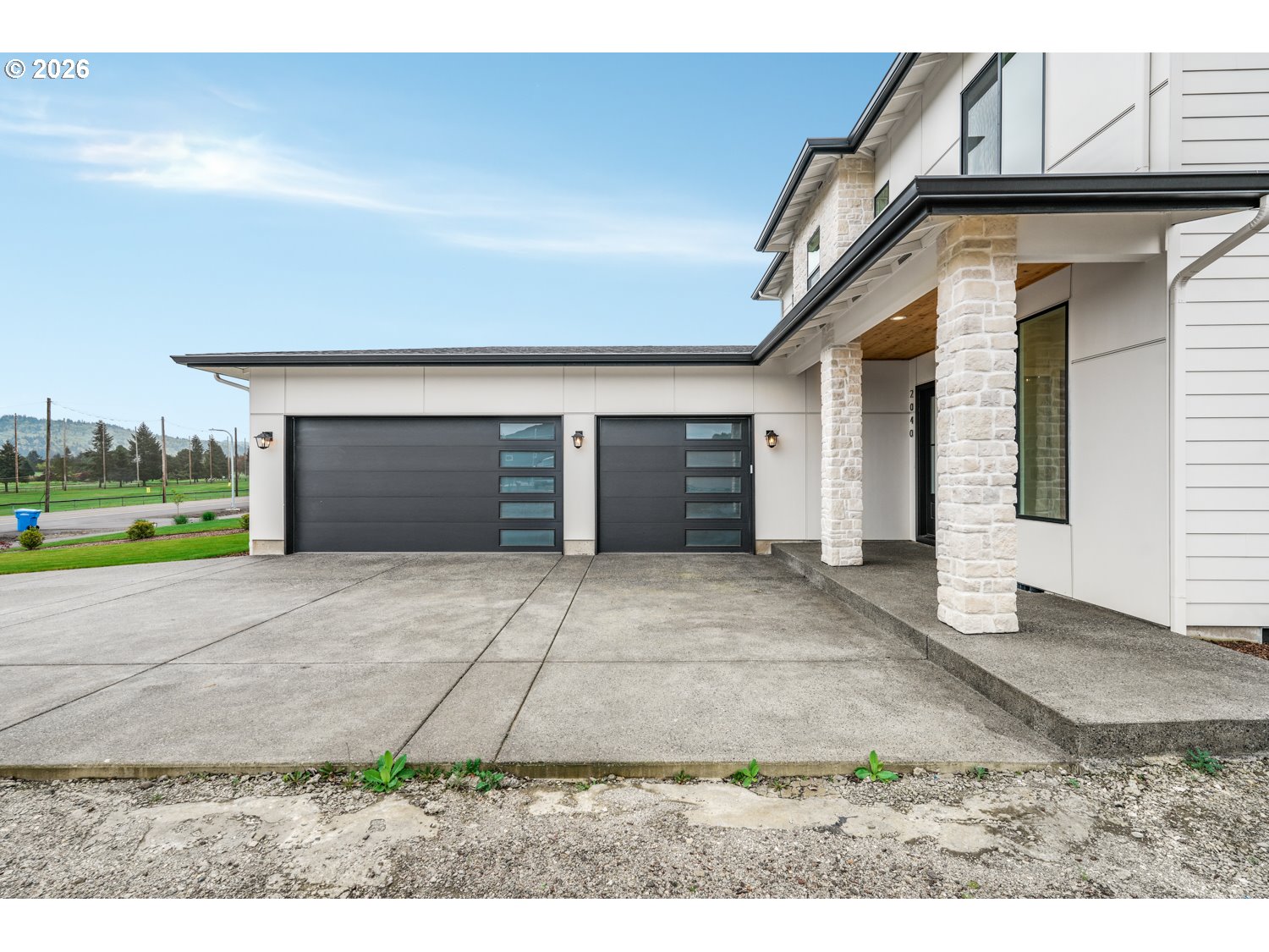 2040 South River Road Kelso, WA 98626 - Photo 43 of 43 a front view of a house with a yard and garage
