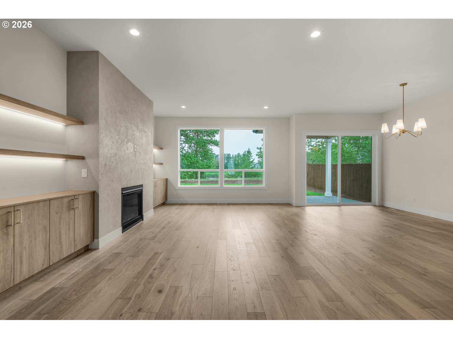 2040 South River Road Kelso, WA 98626 - Photo 6 of 43 an empty room with wooden floor and windows