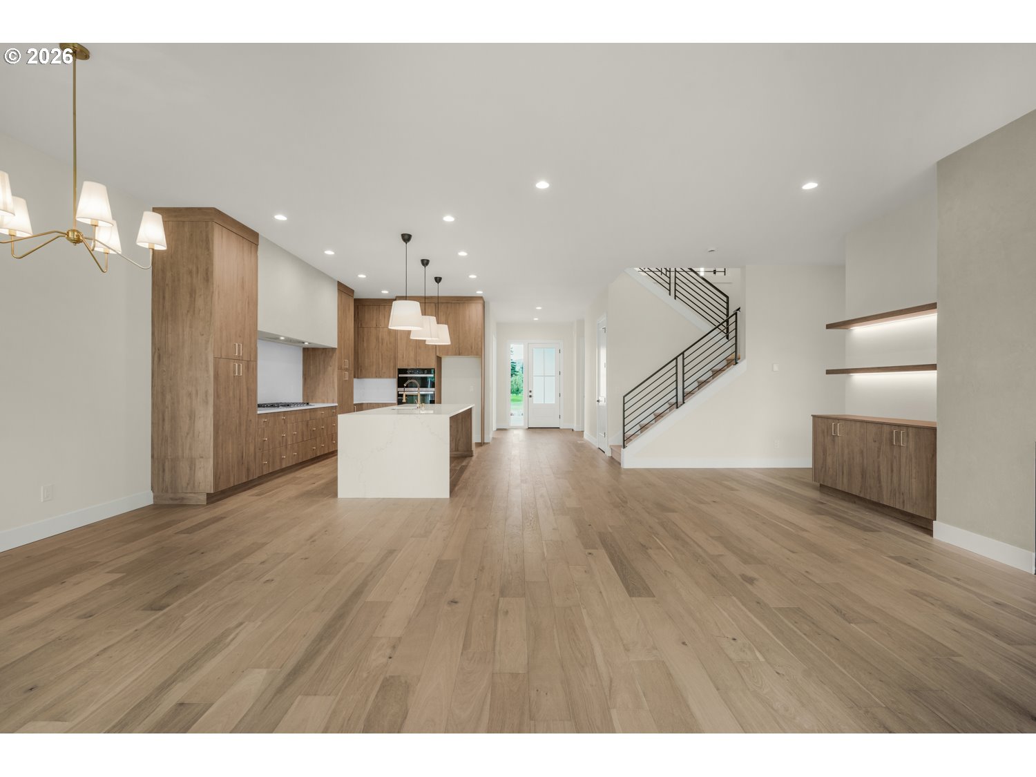 2040 South River Road Kelso, WA 98626 - Photo 8 of 43 a view of a kitchen center island wooden floor stainless steel appliances and a window