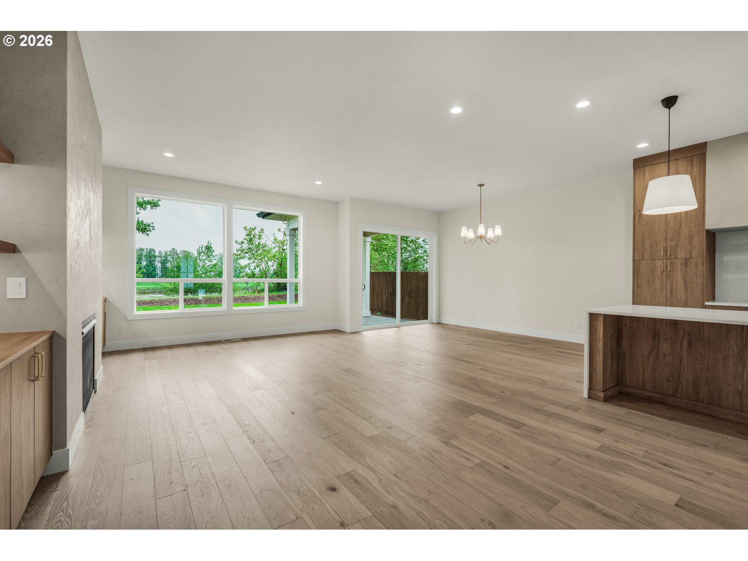 2040 South River Road Kelso, WA 98626 - Photo 9 of 43 a view of an empty room with wooden floor and a window