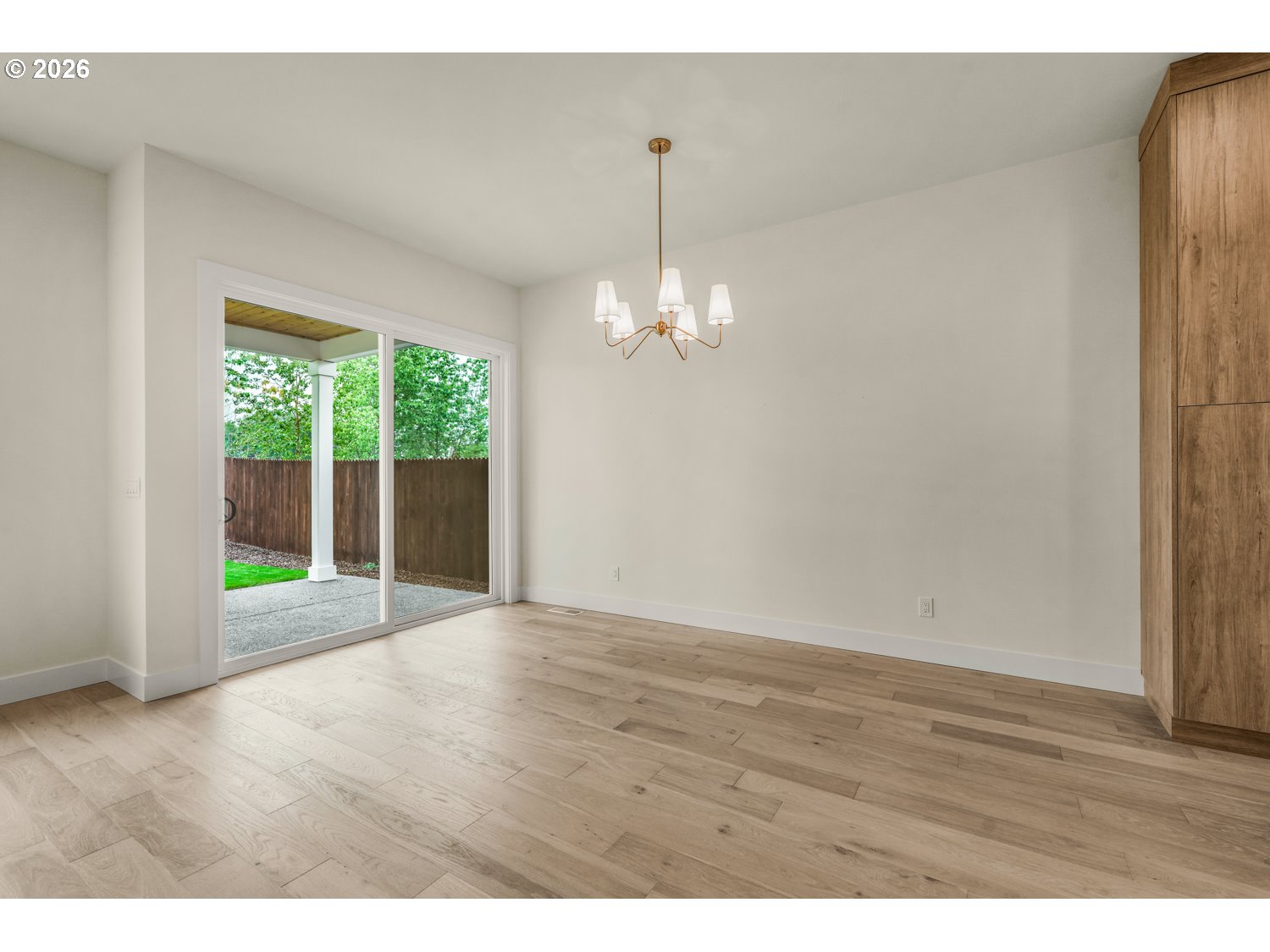 2040 South River Road Kelso, WA 98626 - Photo 10 of 43 a view of an empty room with wooden floor and a window