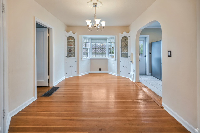 250 West 100 North Logan, UT 84321 - Photo 12 of 41 Dining area. Hardwood flooring and arched walkway/openings