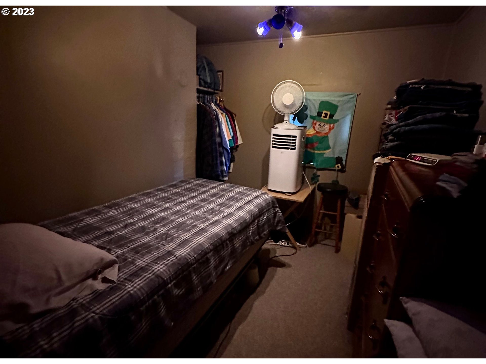 1639 F Street Springfield, OR 97477 - Photo 31 of 32 a bedroom with a bed and a lamp on dresser