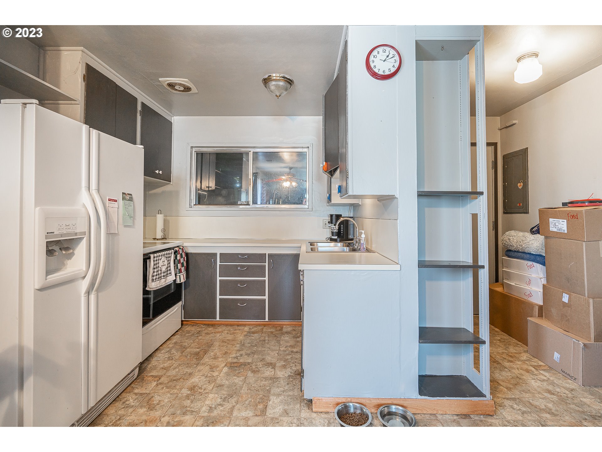 1639 F Street Springfield, OR 97477 - Photo 9 of 32 a kitchen with a refrigerator and a sink