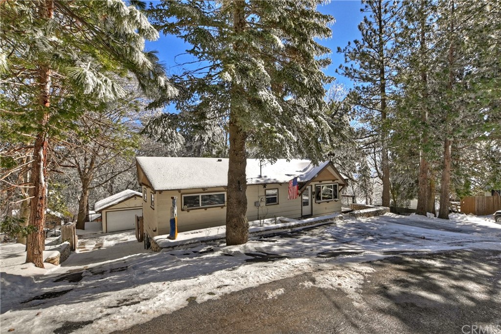26424 Apache Trail Rimforest, CA 92378 - Photo 1 of 1 a view of a house with a tree