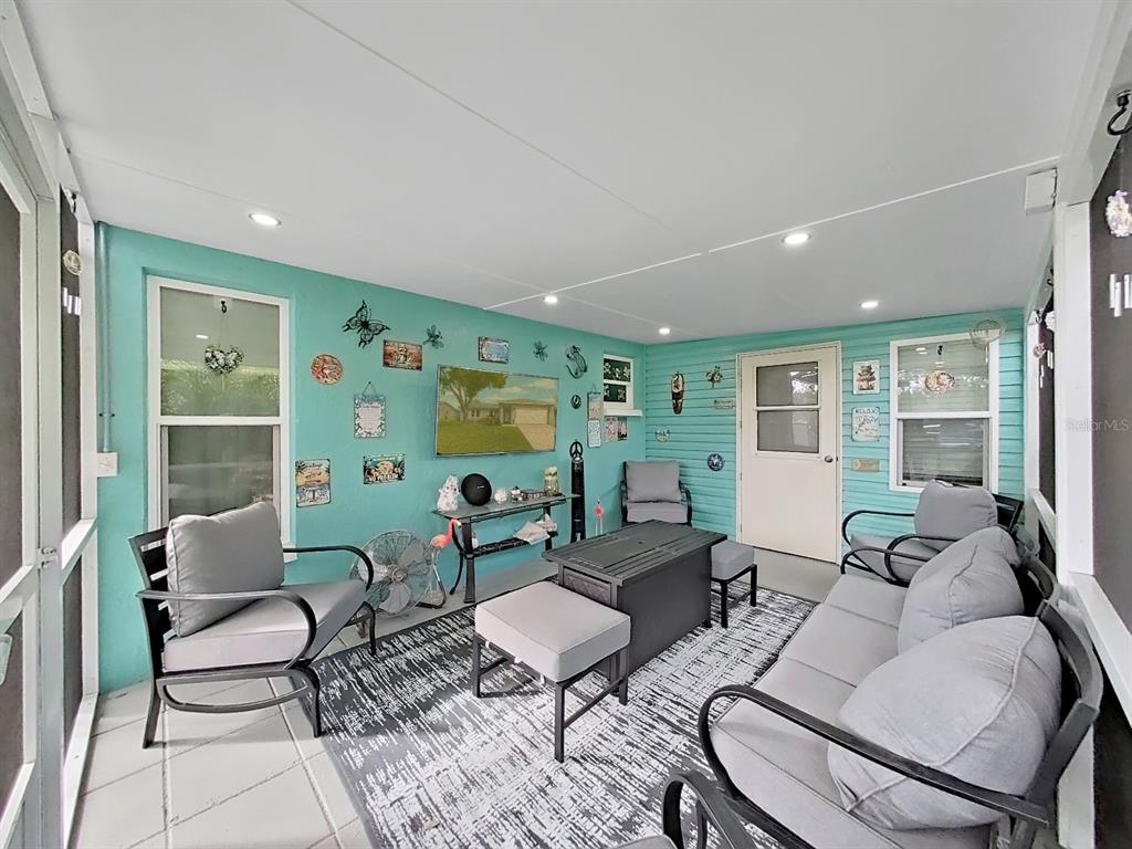 8527 Jolly Roger Drive Hudson, FL 34667 - Photo 19 of 39 a living room with furniture and wooden floor
