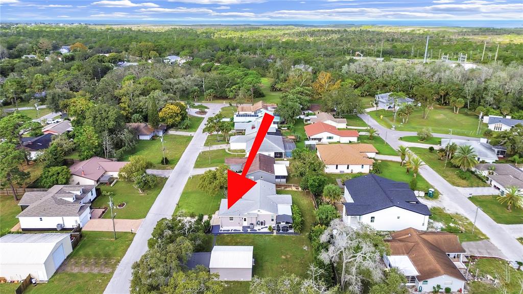 8527 Jolly Roger Drive Hudson, FL 34667 - Photo 23 of 39 an aerial view of residential houses with outdoor space and swimming pool