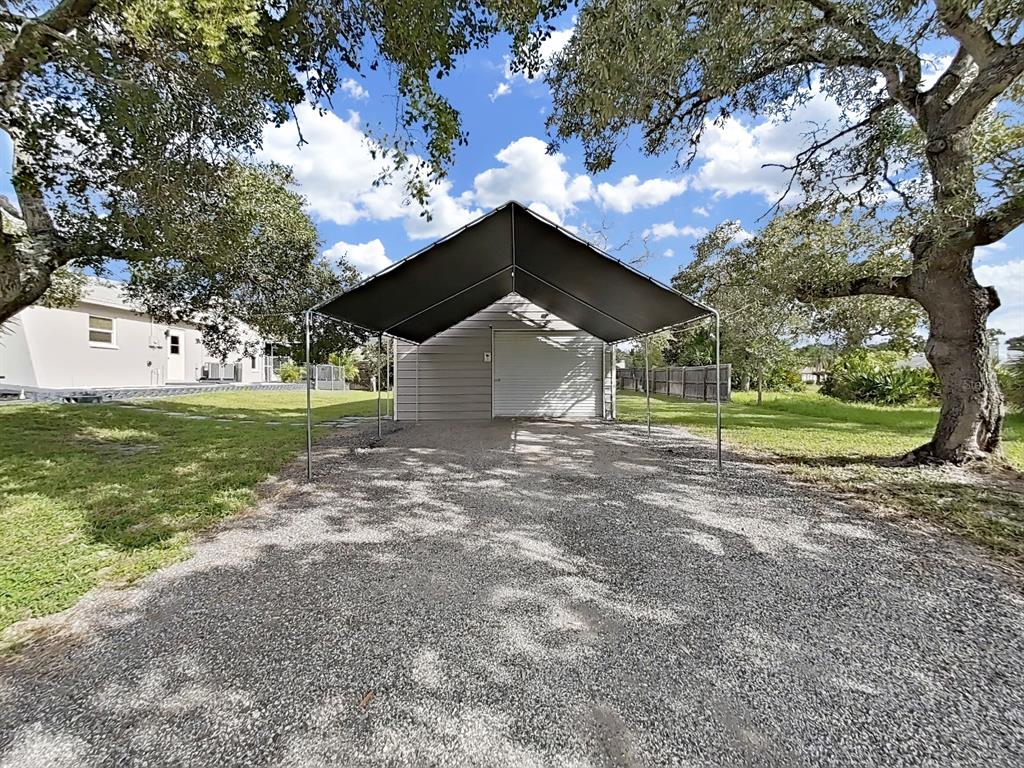 8527 Jolly Roger Drive Hudson, FL 34667 - Photo 25 of 39 a view of a house with a yard