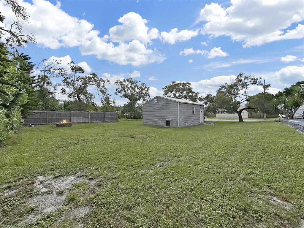 8527 Jolly Roger Drive Hudson, FL 34667 - Photo 27 of 39 a view of a house with a yard