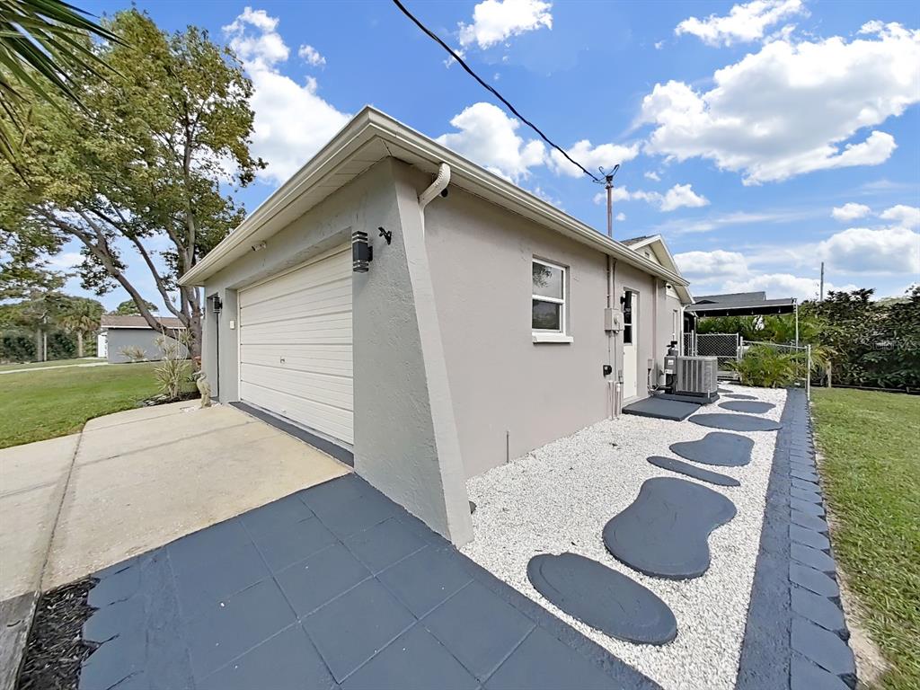 8527 Jolly Roger Drive Hudson, FL 34667 - Photo 31 of 39 a view of backyard of house and car parked
