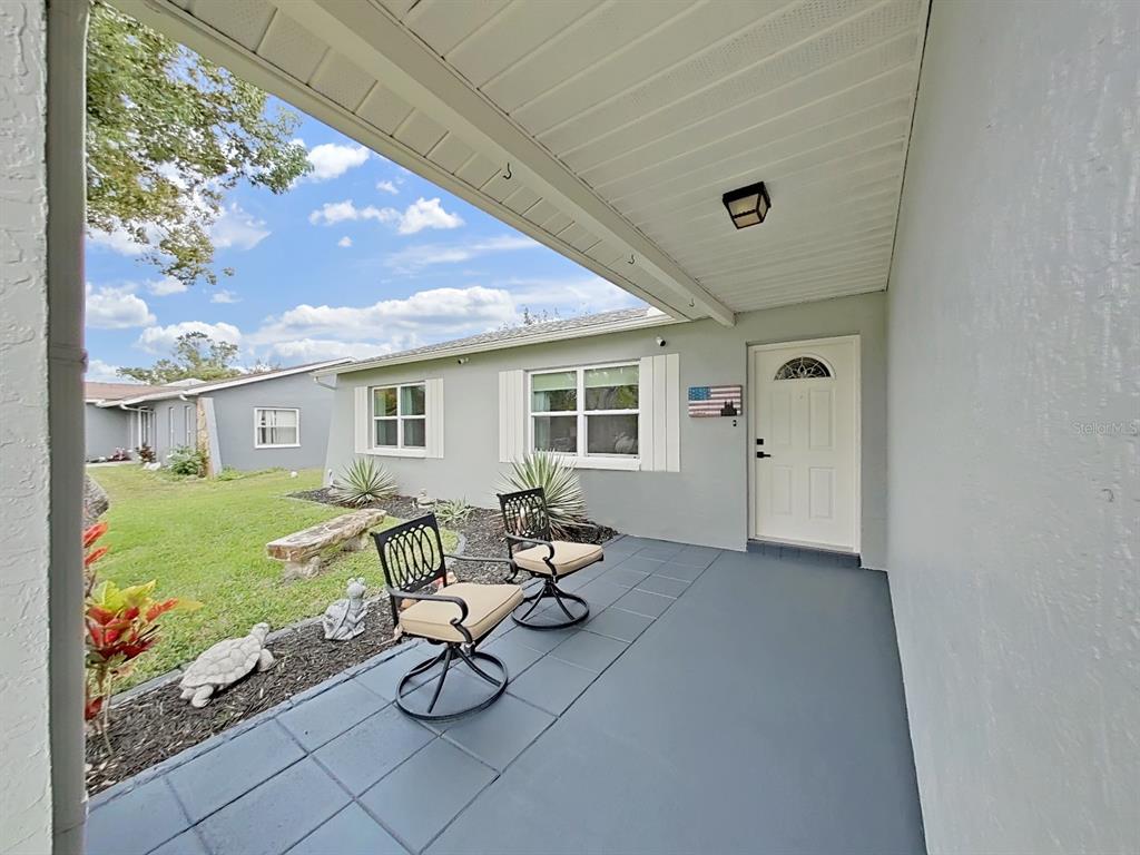 8527 Jolly Roger Drive Hudson, FL 34667 - Photo 35 of 39 a house view with sitting space and garden space