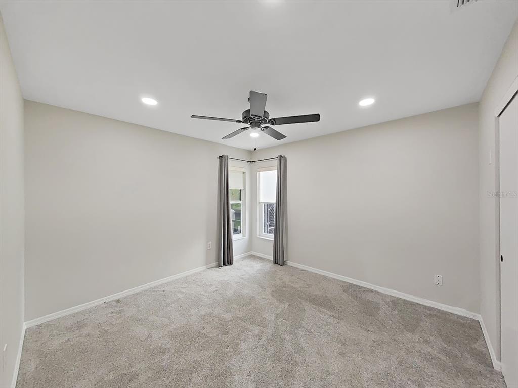 8527 Jolly Roger Drive Hudson, FL 34667 - Photo 7 of 39 a view of a livingroom with a ceiling fan