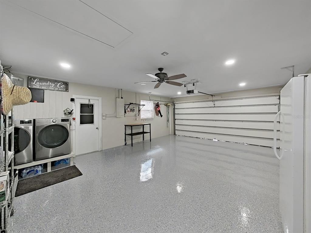 8527 Jolly Roger Drive Hudson, FL 34667 - Photo 9 of 39 a room with gym equipment and mirrors