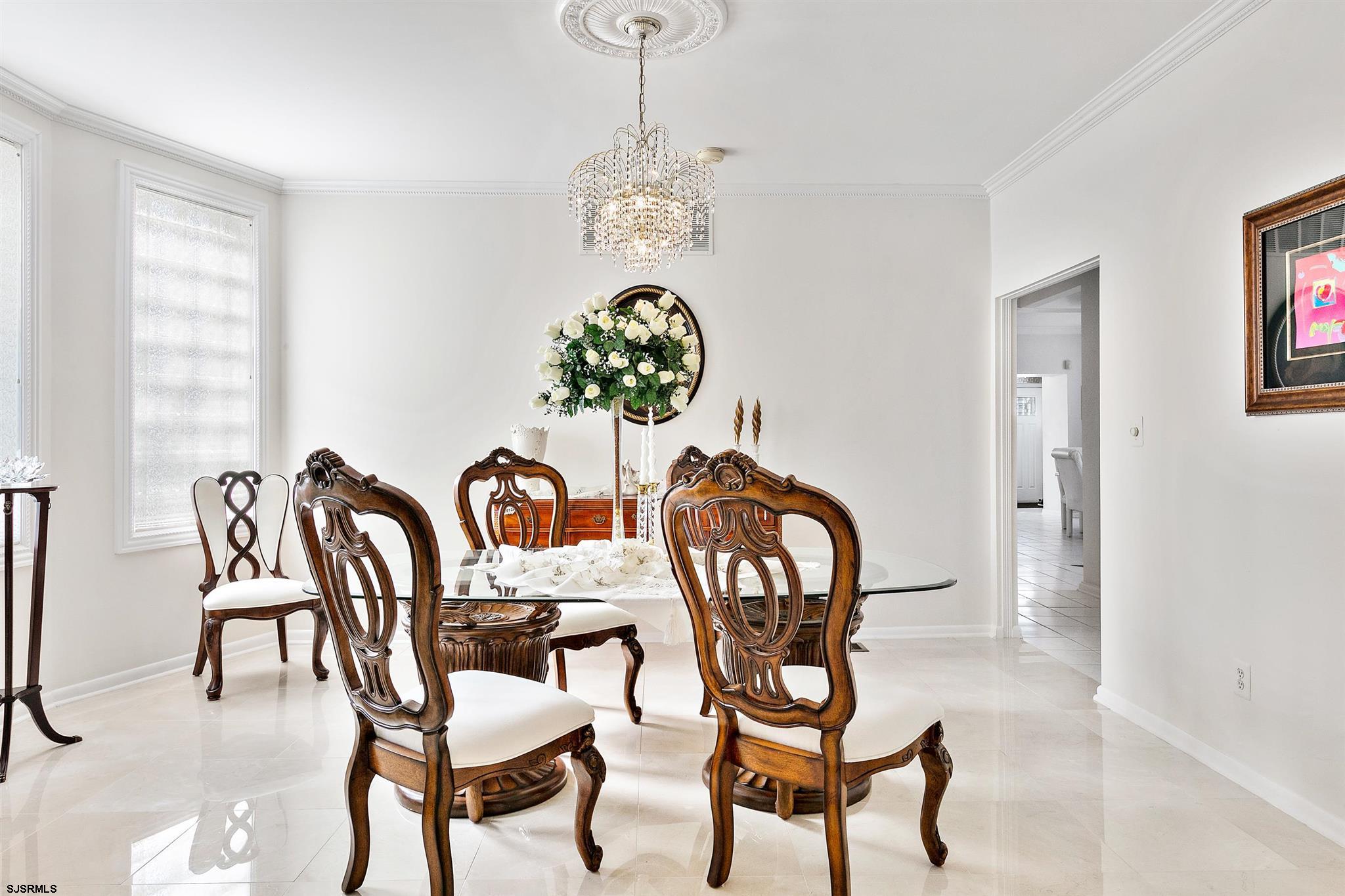 1401 Shore Road Northfield, NJ 08225 - Photo 35 of 96 a view of a dining room with furniture and chandelier