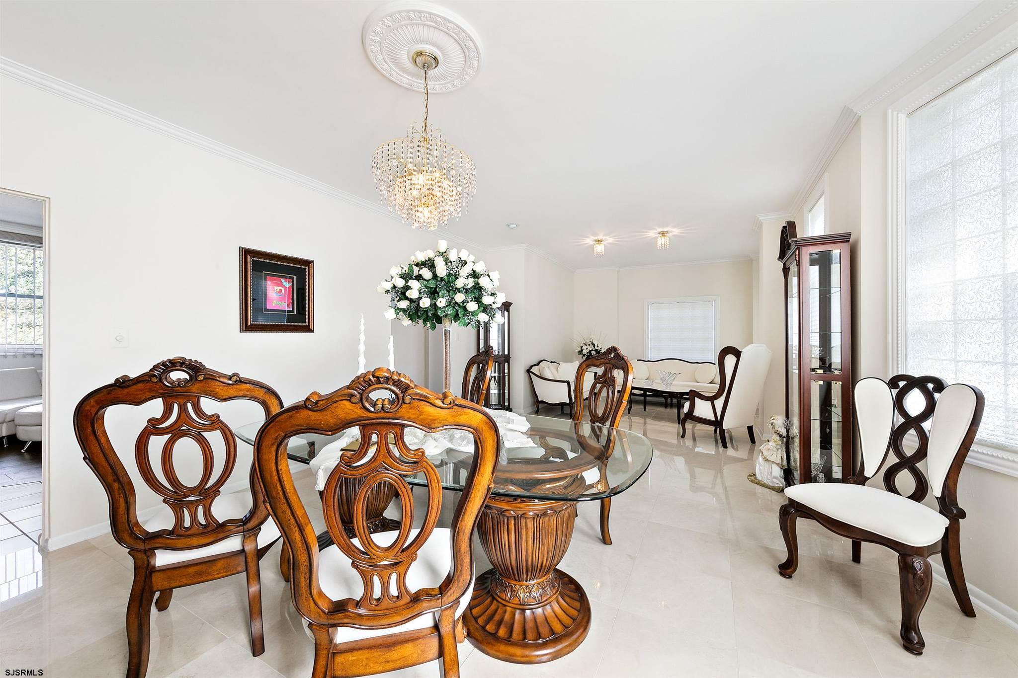 1401 Shore Road Northfield, NJ 08225 - Photo 39 of 96 a view of a dining room with furniture and chandelier
